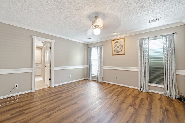 8310 Mentmore Dr, Spring, TX 77379 - unfurnished bedroom with crown molding, wood finished floors, a textured ceiling, a ceiling fan, and baseboards