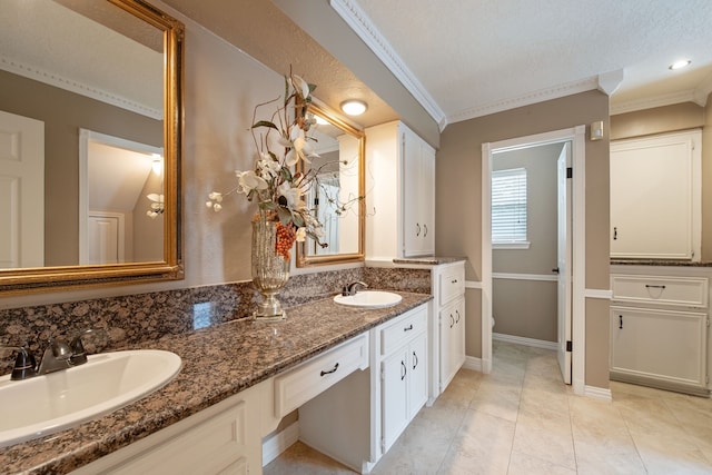 8310 Mentmore Dr, Spring, TX 77379 - full bath with ornamental molding, double vanity, tile patterned flooring, baseboards, and toilet