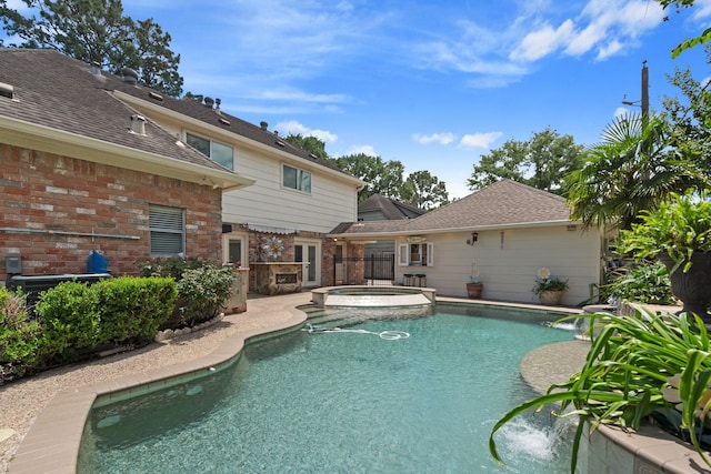 8310 Mentmore Dr, Spring, TX 77379 - view of swimming pool with a pool with connected hot tub and a patio area