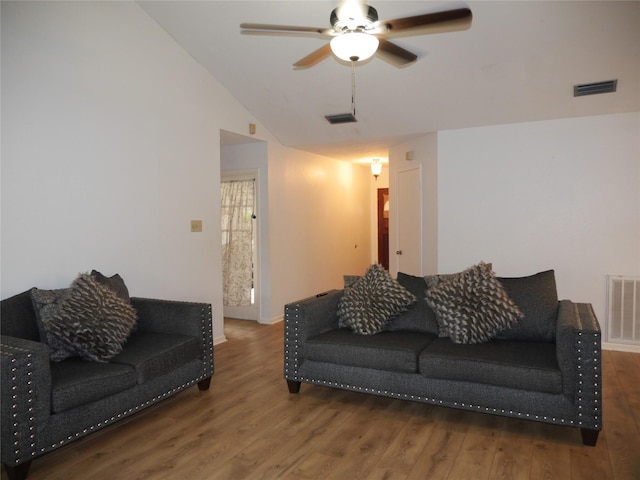 living area with ceiling fan, visible vents, and wood finished floors