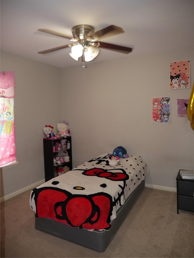 bedroom with baseboards, carpet flooring, and a ceiling fan