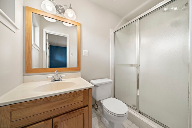 5471 Birdwood Rd, Houston, TX 77096 - full bath featuring a stall shower, toilet, vanity, and tile patterned flooring
