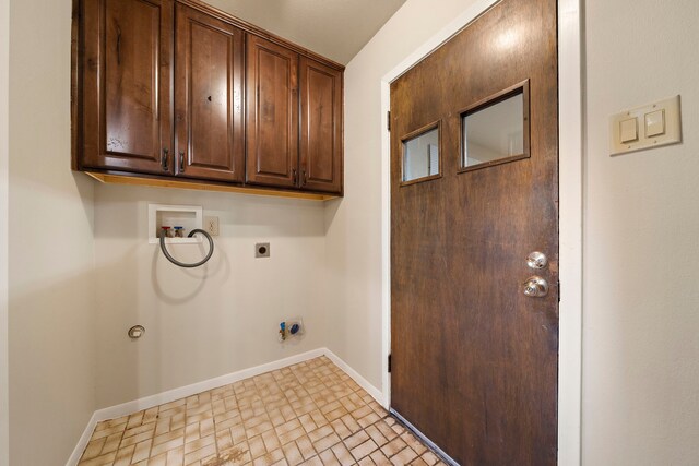 5471 Birdwood Rd, Houston, TX 77096 - washroom with electric dryer hookup, washer hookup, baseboards, cabinet space, and hookup for a gas dryer