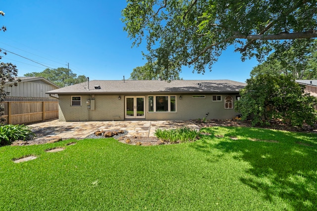 5471 Birdwood Rd, Houston, TX 77096 - back of property featuring a patio, brick siding, french doors, and a shingled roof