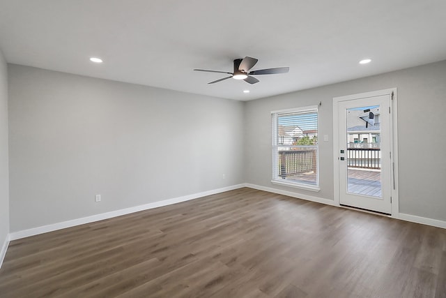 empty room featuring dark wood finished floors, baseboards, ceiling fan, and recessed lighting