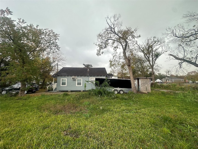 back of property featuring a yard