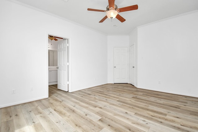 unfurnished bedroom with ornamental molding, light wood finished floors, a ceiling fan, and baseboards