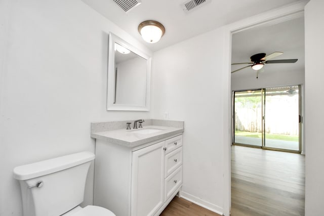 2207 Bauer Dr Unit A, Houston, TX 77080 - bathroom with wood finished floors, toilet, vanity, and ceiling fan