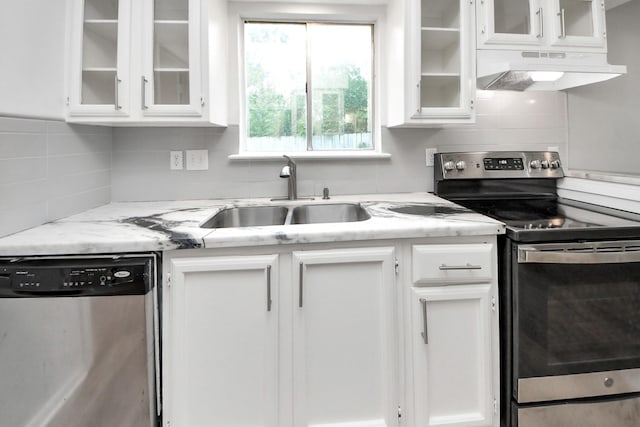 2207 Bauer Dr Unit A, Houston, TX 77080 - kitchen with stainless steel appliances, under cabinet range hood, a sink, and white cabinetry