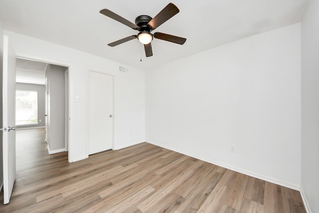 2207 Bauer Dr Unit A, Houston, TX 77080 - unfurnished bedroom featuring wood finished floors, baseboards, and ceiling fan