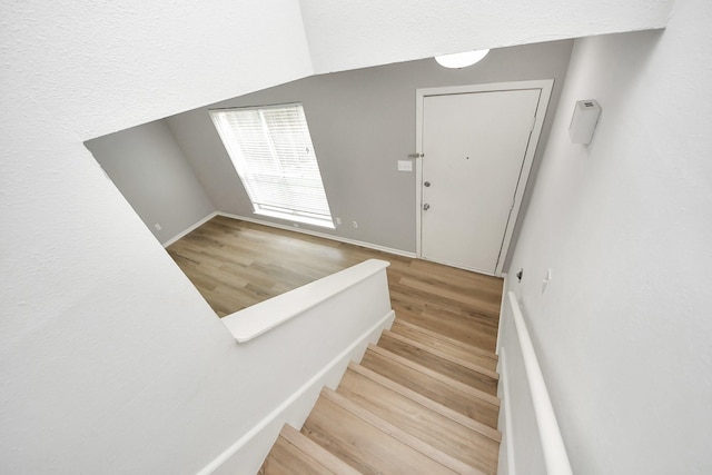 2207 Bauer Dr Unit A, Houston, TX 77080 - staircase featuring wood finished floors and baseboards