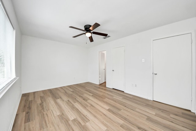 2207 Bauer Dr Unit A, Houston, TX 77080 - unfurnished bedroom featuring light wood-style flooring, baseboards, and a ceiling fan