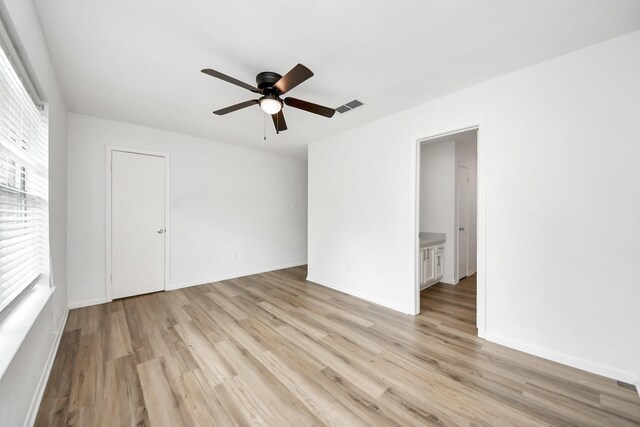 2207 Bauer Dr Unit A, Houston, TX 77080 - spare room with light wood-type flooring, a ceiling fan, and baseboards