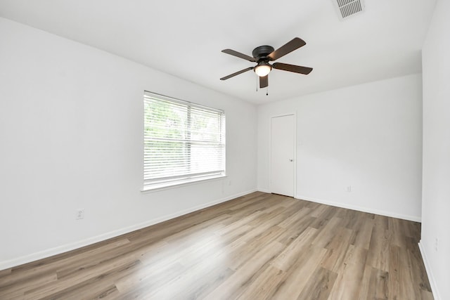 2207 Bauer Dr Unit A, Houston, TX 77080 - spare room with wood finished floors, a ceiling fan, and baseboards