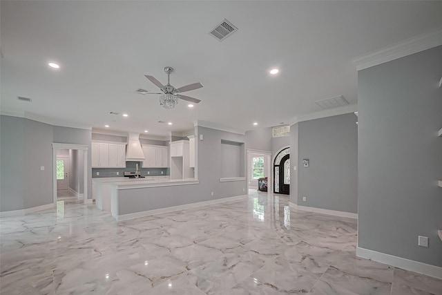 403 Smith St, Dayton, TX 77535 - unfurnished living room with baseboards, ornamental molding, and a wealth of natural light
