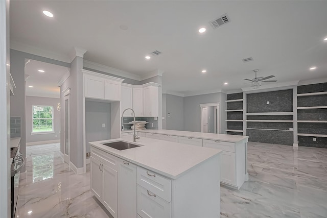 403 Smith St, Dayton, TX 77535 - kitchen with a sink, crown molding, marble finish floor, and visible vents