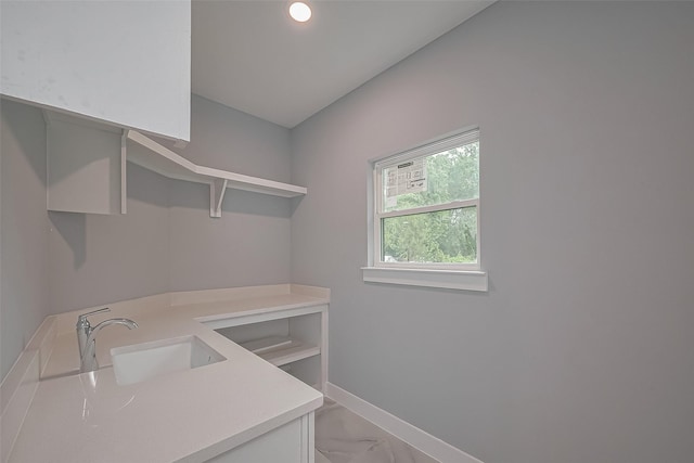 403 Smith St, Dayton, TX 77535 - washroom with recessed lighting, baseboards, a sink, and marble finish floor