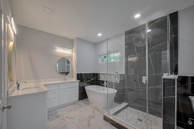 403 Smith St, Dayton, TX 77535 - bathroom featuring visible vents, vanity, marble finish floor, recessed lighting, and a shower stall