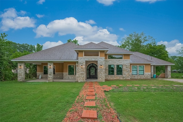 403 Smith St, Dayton, TX 77535 - view of front of property featuring a front yard, stone siding, and stucco siding