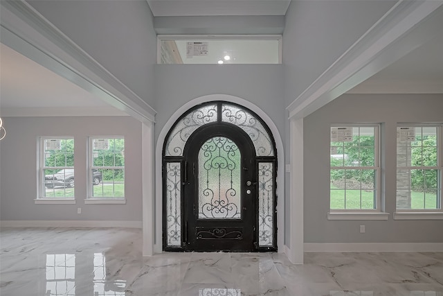 403 Smith St, Dayton, TX 77535 - entryway with baseboards, ornamental molding, a towering ceiling, and marble finish floor