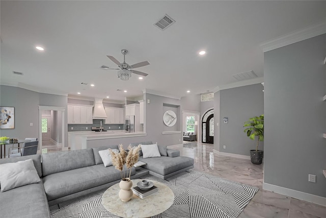 403 Smith St, Dayton, TX 77535 - living area with recessed lighting, light marble finish floors, a ceiling fan, crown molding, and baseboards