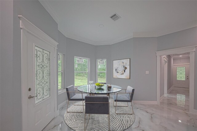 403 Smith St, Dayton, TX 77535 - dining room featuring light marble finish floors, crown molding, and baseboards