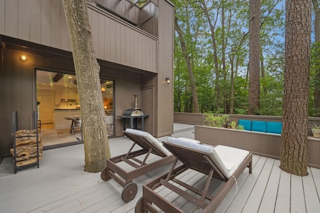 wooden deck featuring an outdoor hangout area and area for grilling