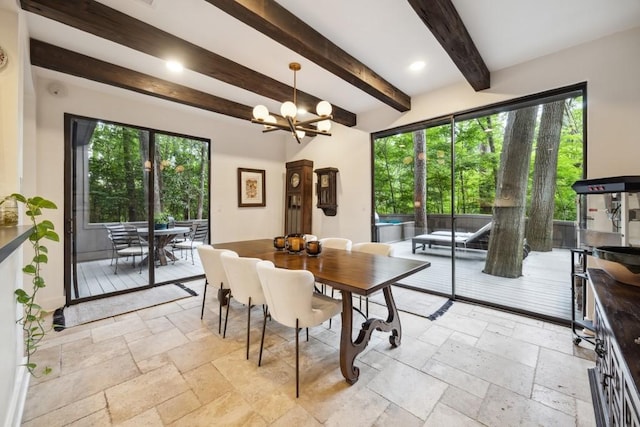 dining space with beamed ceiling, stone tile flooring, and a chandelier