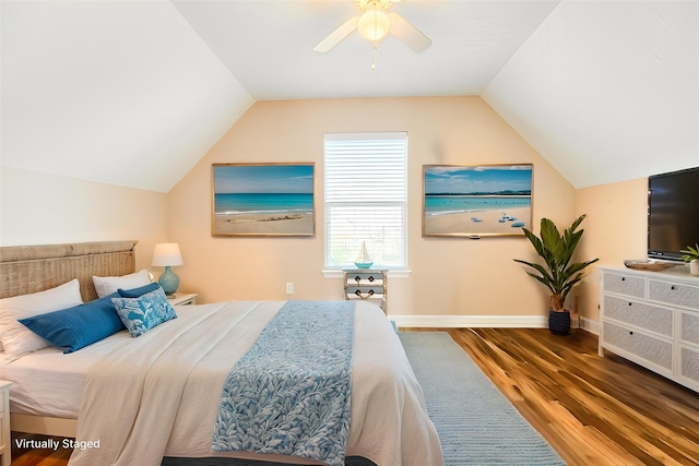 bedroom with wood finished floors, ceiling fan, vaulted ceiling, and baseboards