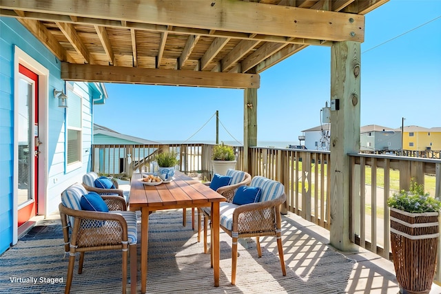 view of wooden balcony featuring outdoor dining area and a wooden deck