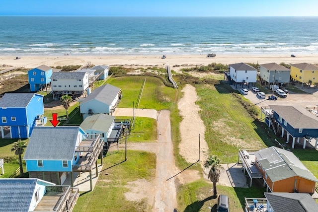 drone / aerial view featuring a view of the beach and a water view