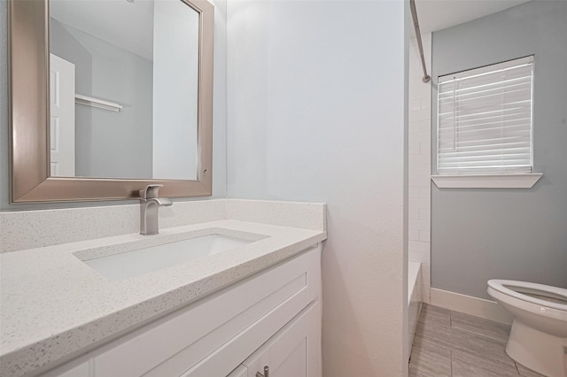 bathroom with toilet and vanity