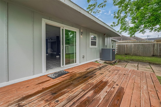 wooden deck featuring fence and central air condition unit