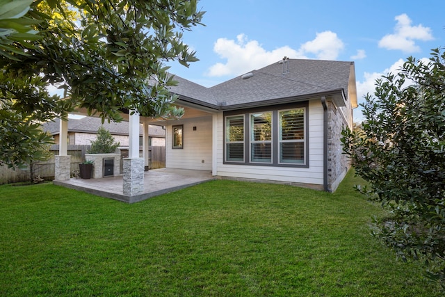 549 Timber Voyage Ct, Conroe, TX 77304 - rear view of property with a yard, a patio, fence, and a shingled roof