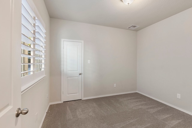 549 Timber Voyage Ct, Conroe, TX 77304 - carpeted spare room featuring baseboards and visible vents