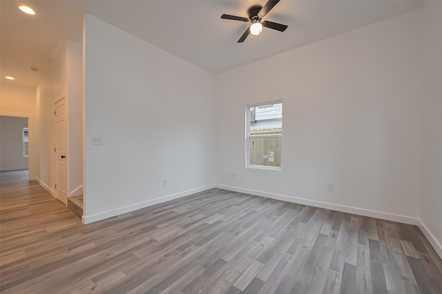 9003 Hilda St, Houston, TX 77033 - empty room with wood finished floors, ceiling fan, baseboards, and recessed lighting