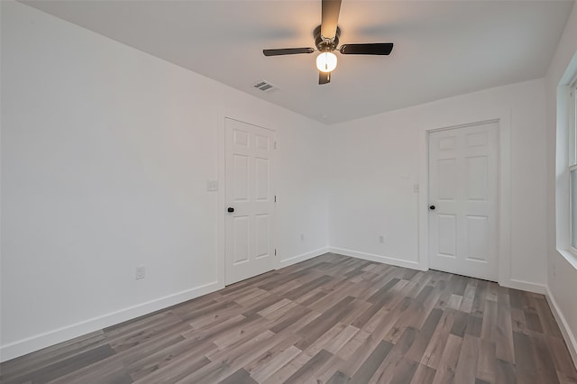 9003 Hilda St, Houston, TX 77033 - unfurnished room with a ceiling fan, baseboards, and wood finished floors