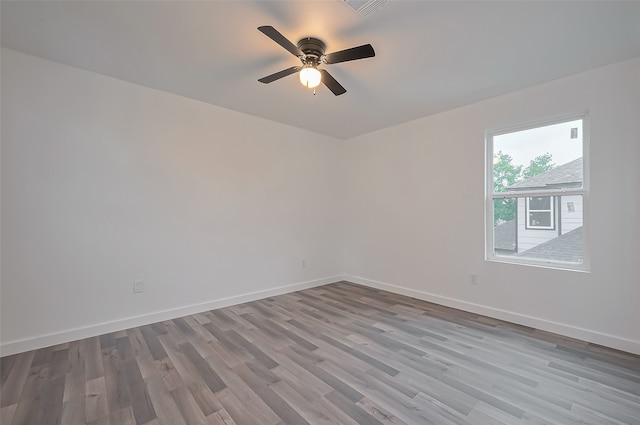 9003 Hilda St, Houston, TX 77033 - unfurnished room featuring wood finished floors, baseboards, and ceiling fan