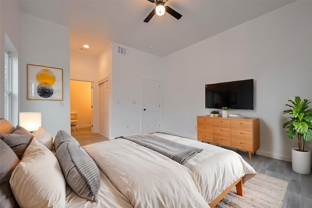 9003 Hilda St, Houston, TX 77033 - bedroom with light wood-style flooring, baseboards, and a ceiling fan