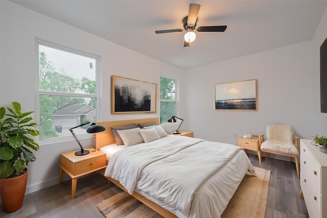 9003 Hilda St, Houston, TX 77033 - bedroom featuring wood finished floors, baseboards, and a ceiling fan