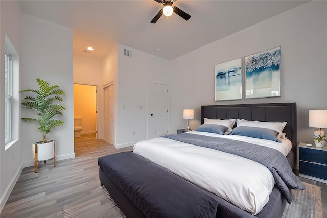 9003 Hilda St, Houston, TX 77033 - bedroom with light wood-style floors, baseboards, connected bathroom, a ceiling fan, and recessed lighting