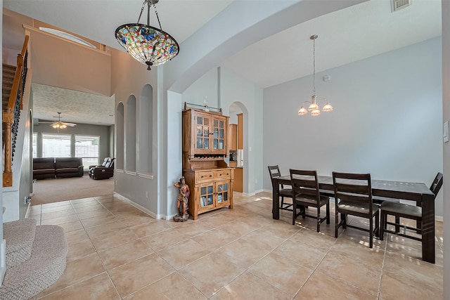 1839 Pembrook Cir, Conroe, TX 77301 - dining area with light tile patterned flooring, visible vents, baseboards, and arched walkways