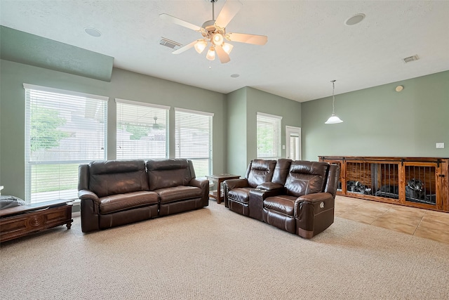 1839 Pembrook Cir, Conroe, TX 77301 - carpeted living room with visible vents and ceiling fan
