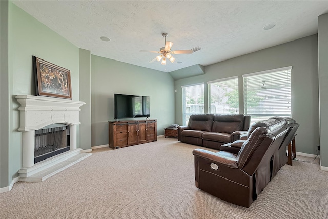 1839 Pembrook Cir, Conroe, TX 77301 - living area with carpet flooring, a fireplace with raised hearth, a ceiling fan, visible vents, and baseboards