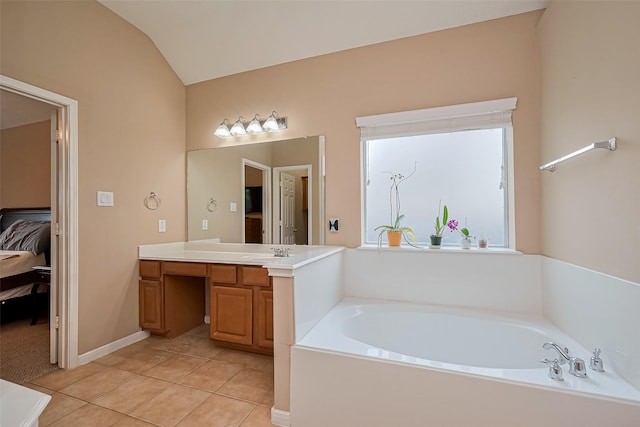 1839 Pembrook Cir, Conroe, TX 77301 - ensuite bathroom with ensuite bathroom, a bath, vaulted ceiling, vanity, and tile patterned flooring