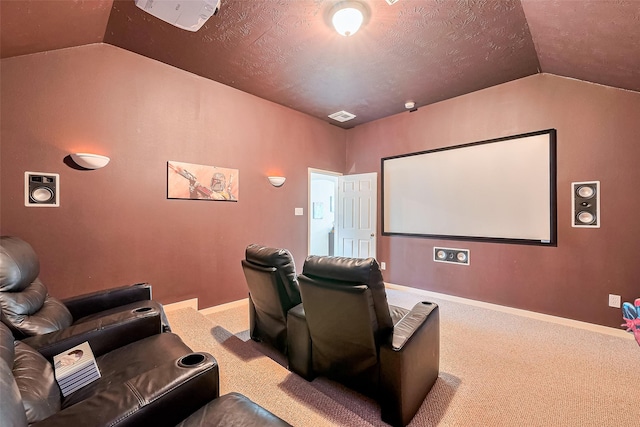1839 Pembrook Cir, Conroe, TX 77301 - home theater featuring carpet flooring, visible vents, lofted ceiling, and baseboards