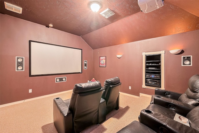 1839 Pembrook Cir, Conroe, TX 77301 - carpeted cinema with a textured ceiling, visible vents, vaulted ceiling, and baseboards