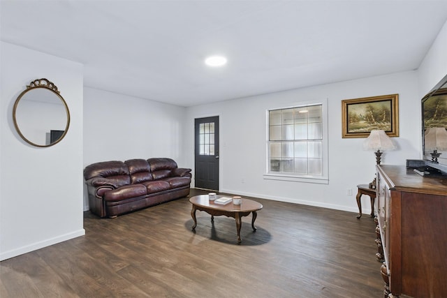 living room featuring dark wood-style floors and baseboards