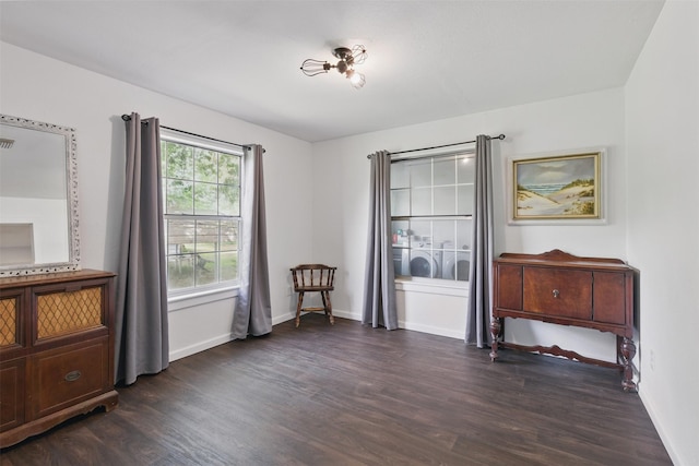 interior space with dark wood-style floors and baseboards