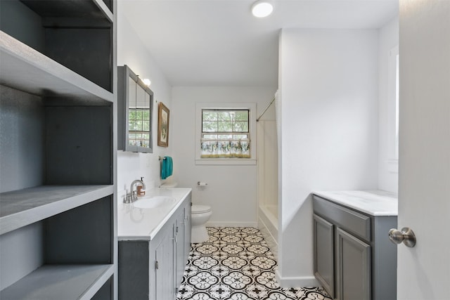 full bathroom featuring vanity, toilet, baseboards, tile patterned flooring, and shower / tub combo with curtain
